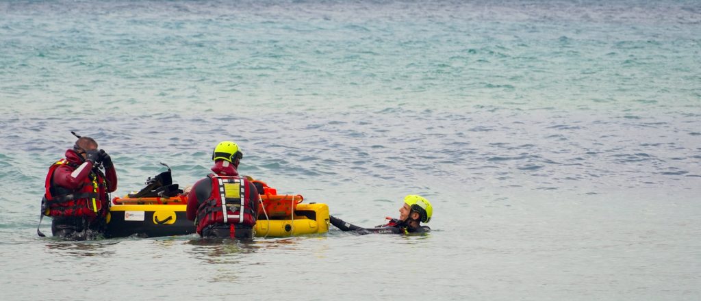 A group of people standing in the water