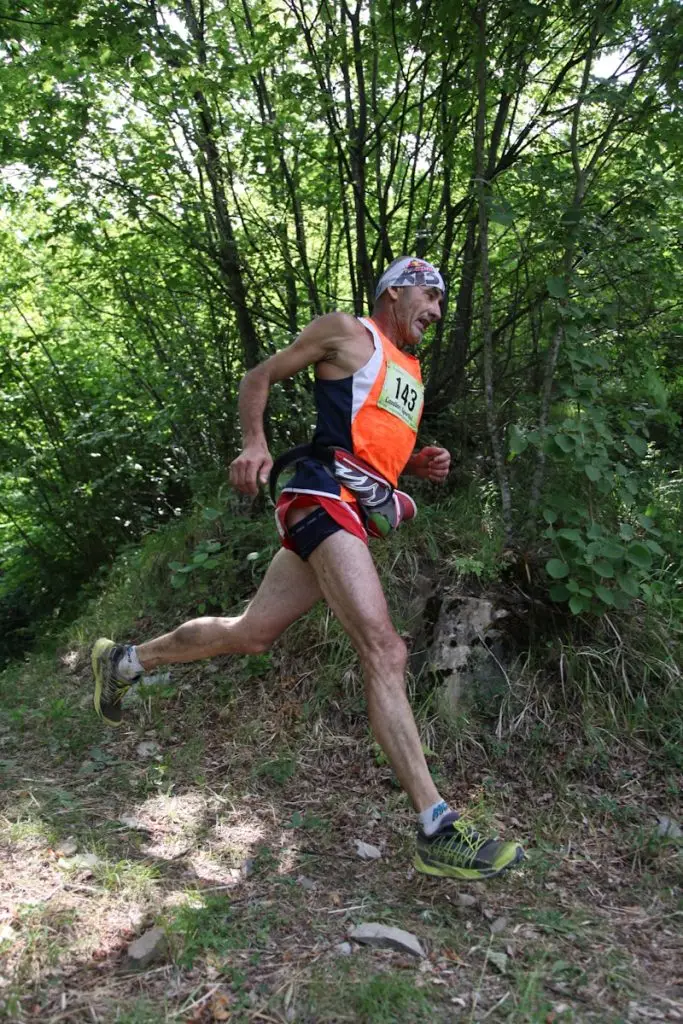 Carney trail race: close-up photography of man running near t rees