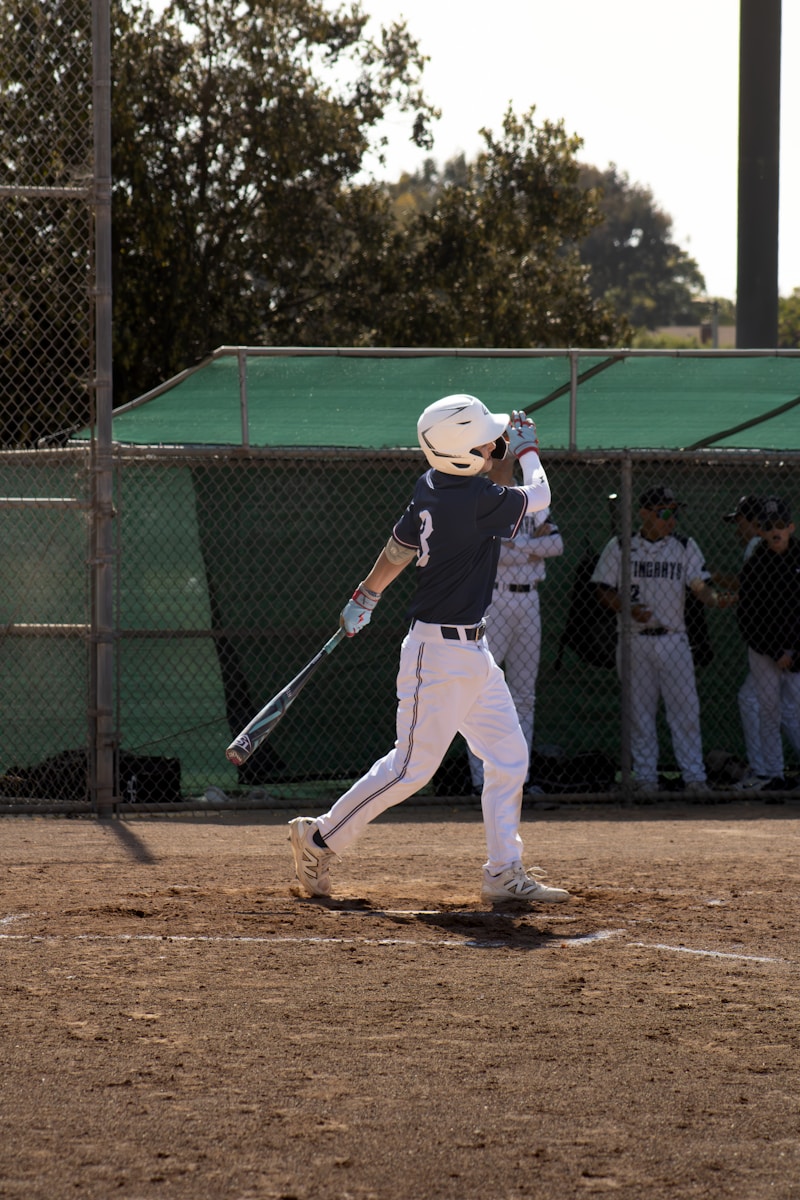 Blue Jays ALDS Win: Baseball player swings bat during a game.